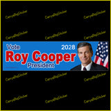 Bumper Sticker or Magnetic Bumper Sticker says, Vote Roy Cooper President 2028. Features photo of Cooper with U.S. flag on a blue background.