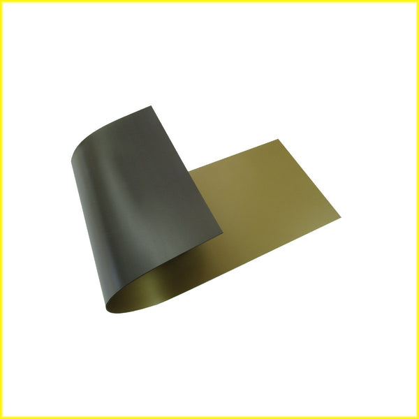 Photo shows piece of flexible gold colored magnetic material. Material is black on the magnetic side.