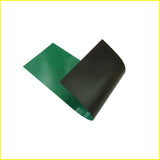 Photo shows piece of flexible green colored magnetic material. Material is black on the magnetic side.